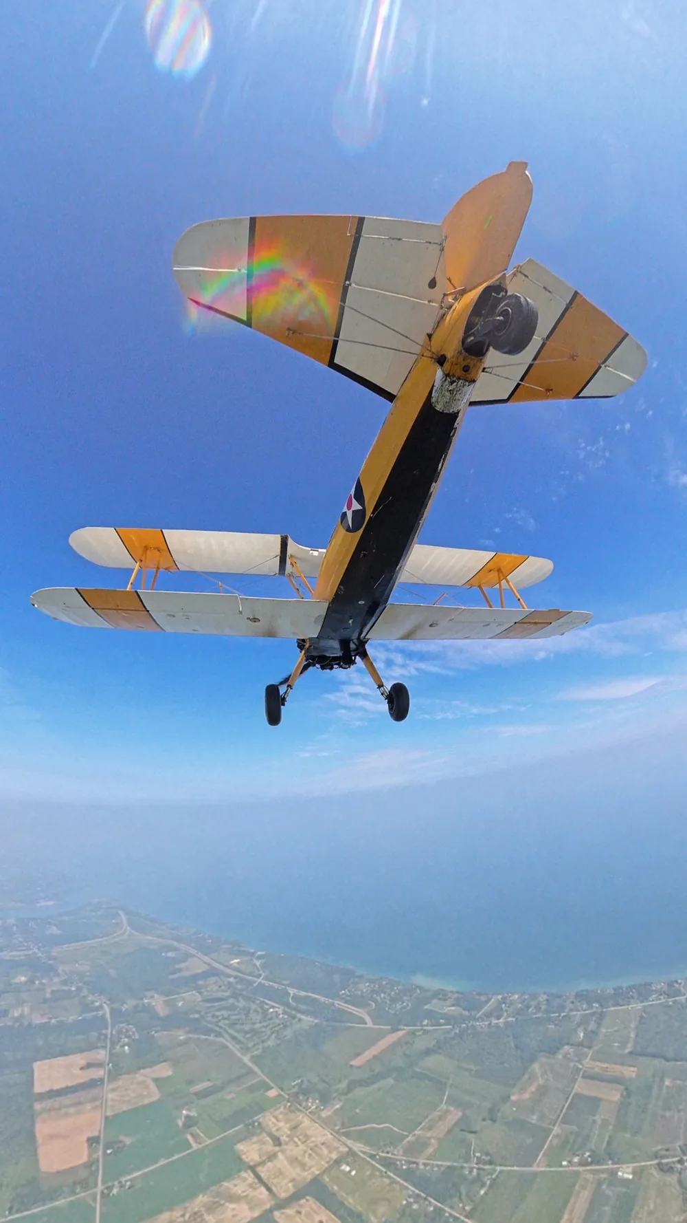 A jump aircraft photographed from below in flight